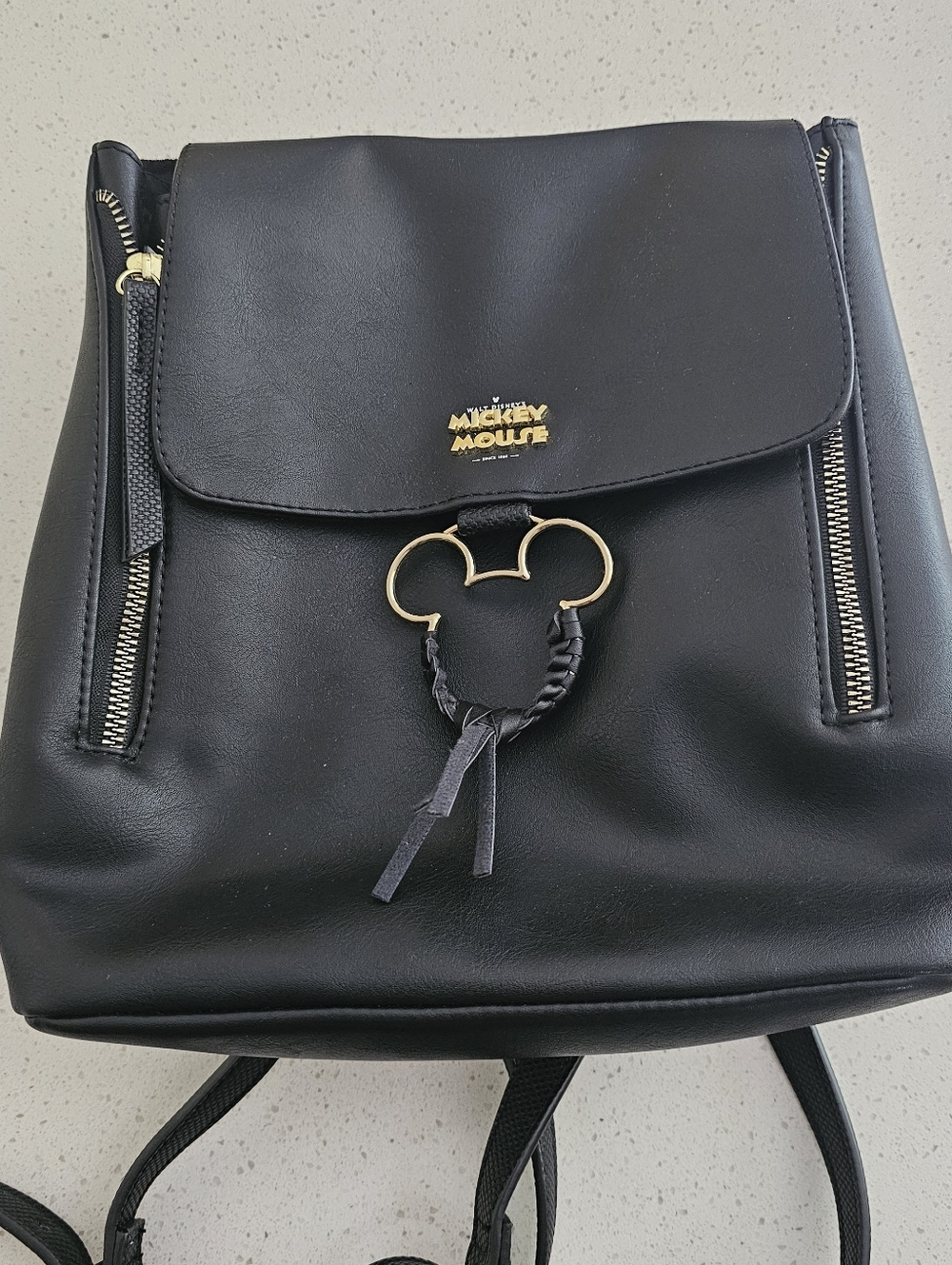 Mickey Mouse black backpack with gold accents and Mickey head